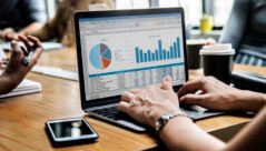 Business people working on a laptop in a meeting